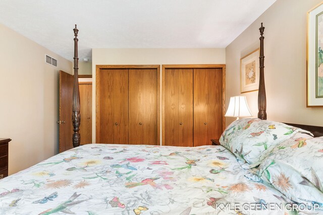 bedroom with multiple closets