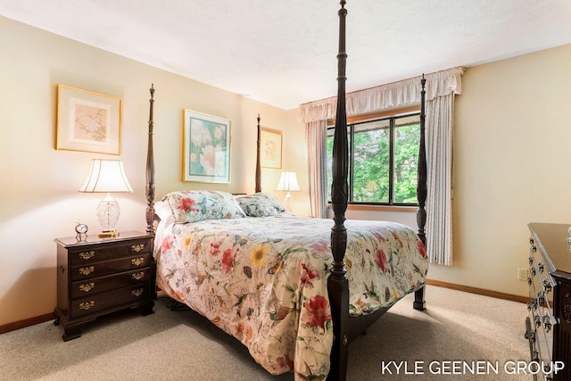 bedroom featuring carpet flooring and baseboards