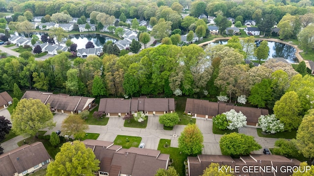 aerial view of residential area featuring a nearby body of water