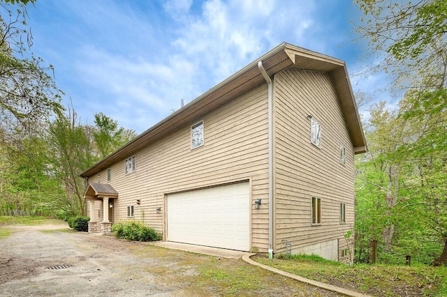 16431 Glassman Rd, Union Pier, MI 49129 - view of home's exterior featuring a garage and driveway