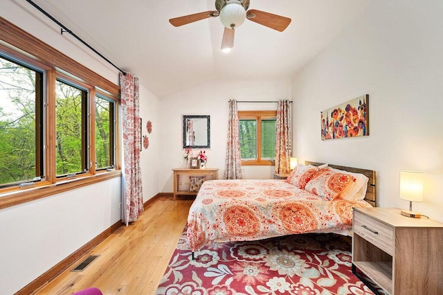 16431 Glassman Rd, Union Pier, MI 49129 - bedroom with lofted ceiling, baseboards, light wood-style flooring, and ceiling fan