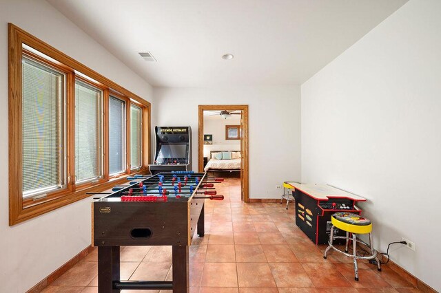16431 Glassman Rd, Union Pier, MI 49129 - rec room featuring baseboards, light tile patterned floors, and a ceiling fan