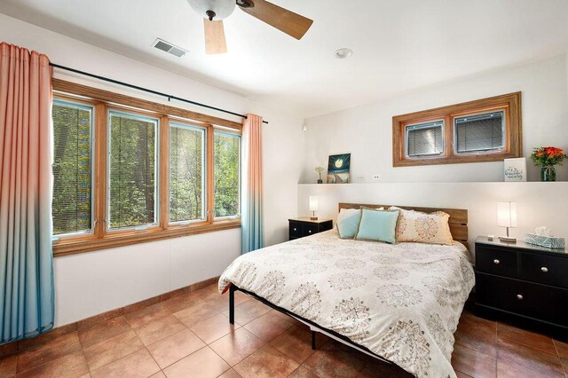 16431 Glassman Rd, Union Pier, MI 49129 - tiled bedroom with a ceiling fan and baseboards