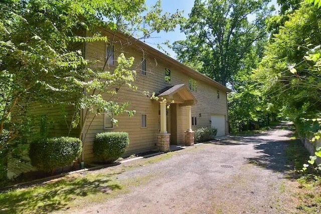 16431 Glassman Rd, Union Pier, MI 49129 - view of front of property with an attached garage and driveway