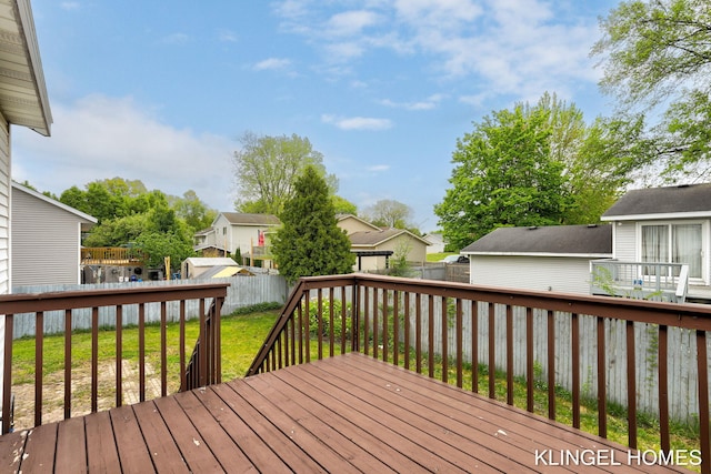 wooden terrace with a residential view