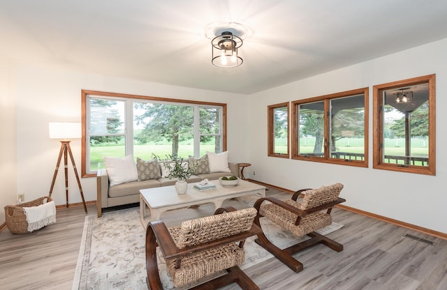 16436 45th Ave, Barryton, MI 49305 - living area featuring baseboards and light wood finished floors