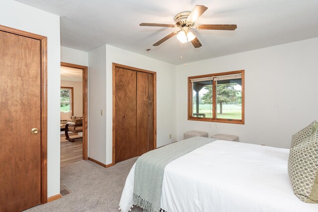 16436 45th Ave, Barryton, MI 49305 - bedroom featuring carpet floors, a ceiling fan, a closet, and baseboards