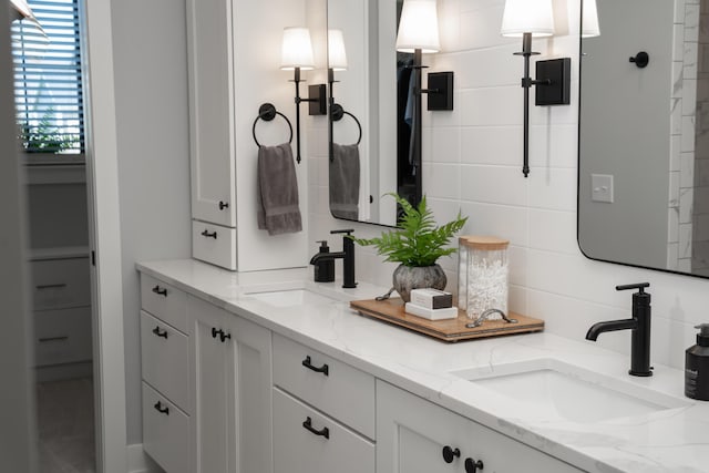 8182 Country Rail Dr SW, Byron Center, MI 49315 - full bath with double vanity and backsplash