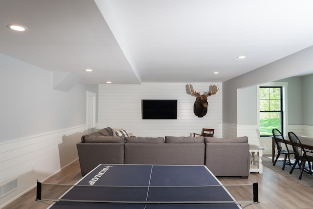 8182 Country Rail Dr SW, Byron Center, MI 49315 - recreation room featuring light wood-style flooring, wood walls, wainscoting, and recessed lighting