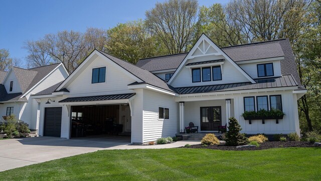 8182 Country Rail Dr SW, Byron Center, MI 49315 - modern farmhouse with a standing seam roof, concrete driveway, french doors, a front lawn, and board and batten siding