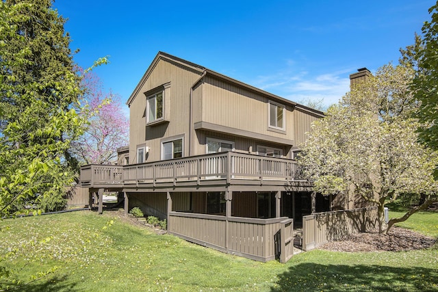 1 Northwick Ct, Ann Arbor, MI 48105 - rear view of property with a deck and a lawn