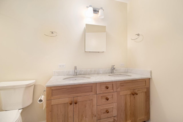 1 Northwick Ct, Ann Arbor, MI 48105 - bathroom with toilet, double vanity, and baseboards