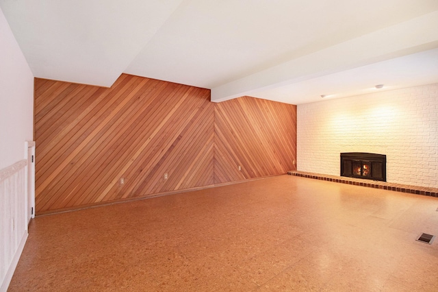 1 Northwick Ct, Ann Arbor, MI 48105 - unfurnished living room featuring a fireplace and wooden walls