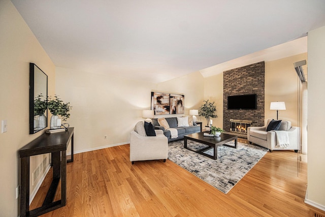 1 Northwick Ct, Ann Arbor, MI 48105 - living room featuring wood finished floors, a fireplace, and baseboards