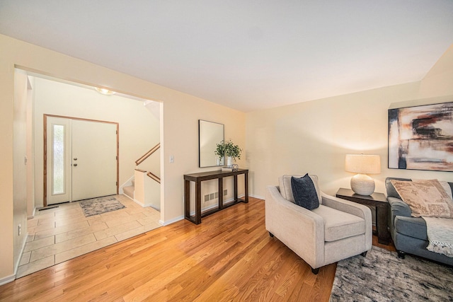 1 Northwick Ct, Ann Arbor, MI 48105 - living room with light wood-style flooring and stairway