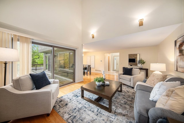 1 Northwick Ct, Ann Arbor, MI 48105 - living area featuring light wood-type flooring and a towering ceiling