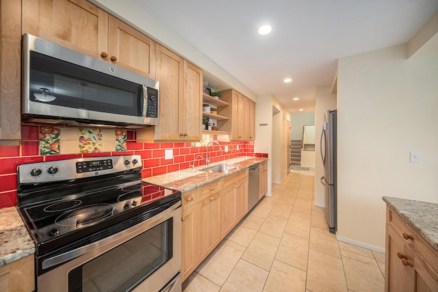 1 Northwick Ct, Ann Arbor, MI 48105 - kitchen with stainless steel appliances, a sink, light brown cabinets, backsplash, and recessed lighting