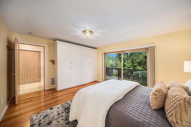 1 Northwick Ct, Ann Arbor, MI 48105 - bedroom with access to exterior, light wood-style floors, baseboards, and a closet