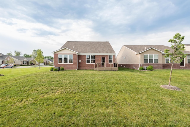 50305 Thatcher St, Canton, MI 48188 - back of property featuring brick siding, a lawn, and a deck