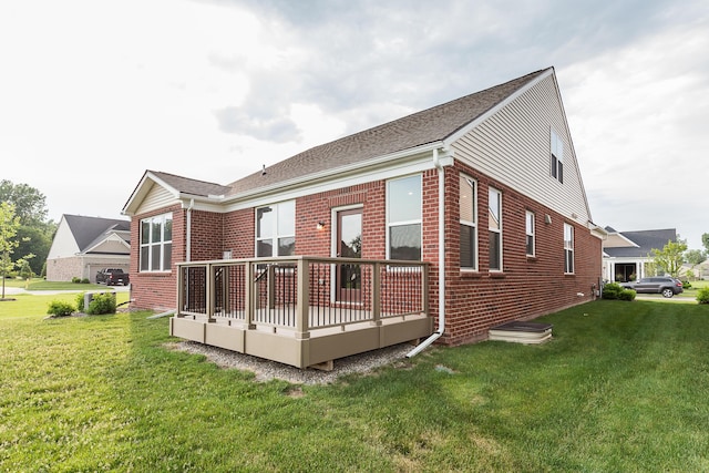 50305 Thatcher St, Canton, MI 48188 - back of house with brick siding, a deck, and a lawn