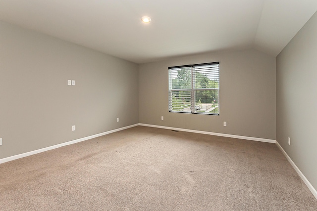 50305 Thatcher St, Canton, MI 48188 - spare room featuring carpet floors, vaulted ceiling, baseboards, and recessed lighting