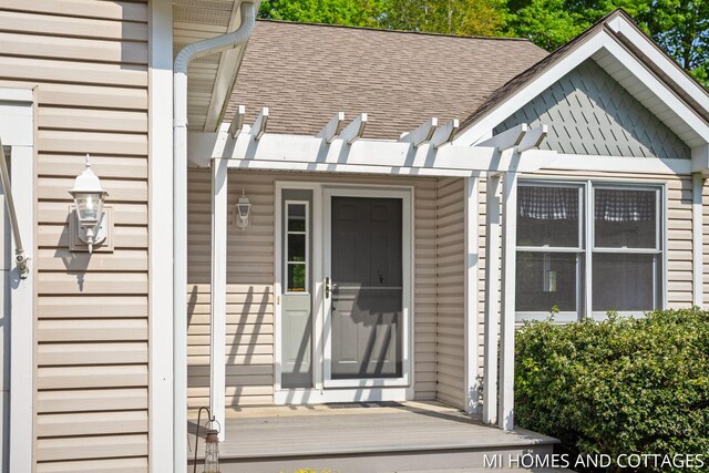 3760 Lakeshore Dr, Holland, MI 49424 - property entrance with roof with shingles and a pergola