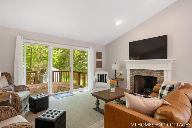 3760 Lakeshore Dr, Holland, MI 49424 - carpeted living room with vaulted ceiling and a fireplace