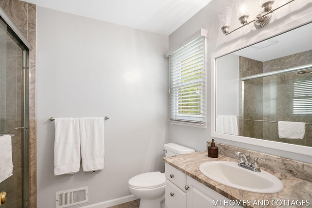 3760 Lakeshore Dr, Holland, MI 49424 - bathroom with toilet, vanity, and tiled shower
