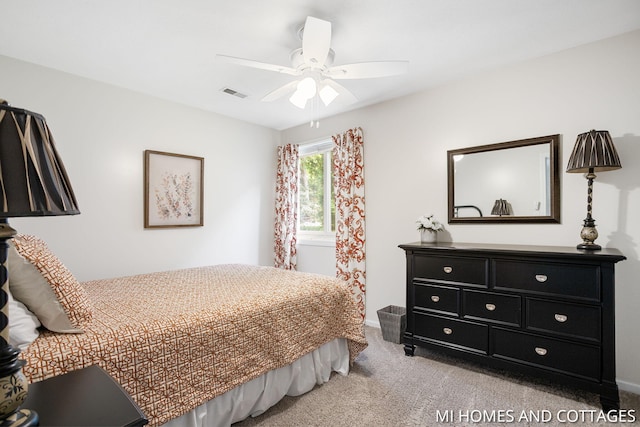 3760 Lakeshore Dr, Holland, MI 49424 - bedroom featuring light colored carpet, ceiling fan, and baseboards