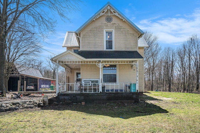 2640 Terminal St, Niles, MI 49120 - victorian house featuring covered porch and a front lawn