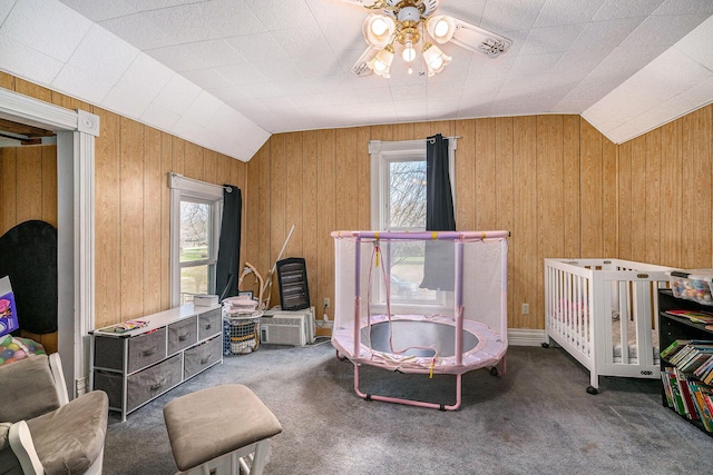 2640 Terminal St, Niles, MI 49120 - bedroom featuring vaulted ceiling, multiple windows, carpet flooring, and wooden walls