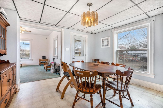 2640 Terminal St, Niles, MI 49120 - dining area featuring light flooring, baseboards, a chandelier, and ceiling fan