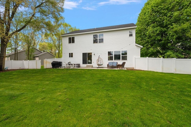 rear view of house with a patio