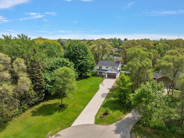 view of subject property with a heavily wooded area