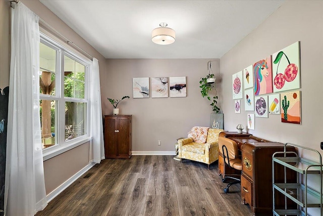 office space with wood finished floors and baseboards
