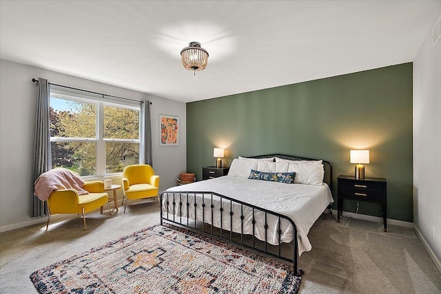 bedroom with carpet floors and baseboards