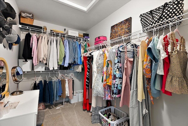 walk in closet featuring carpet