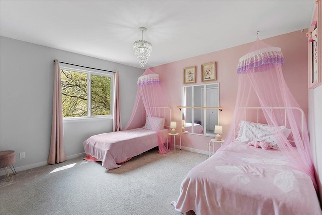 bedroom with carpet floors and baseboards