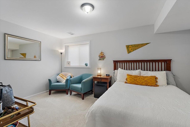 bedroom featuring carpet floors and baseboards
