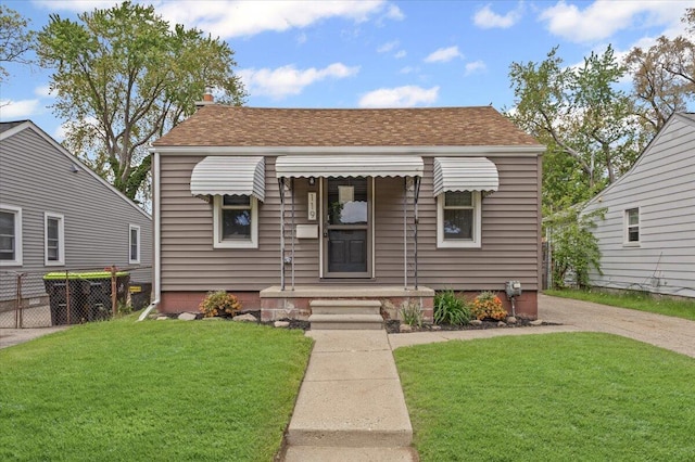 view of front of home featuring a shingled roof