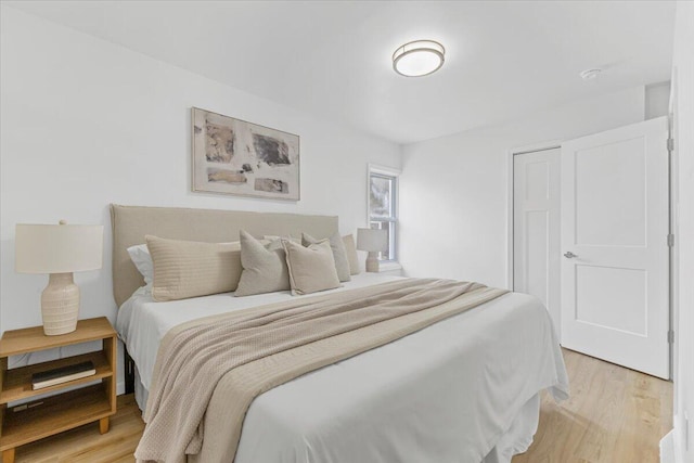 bedroom featuring light wood-style floors