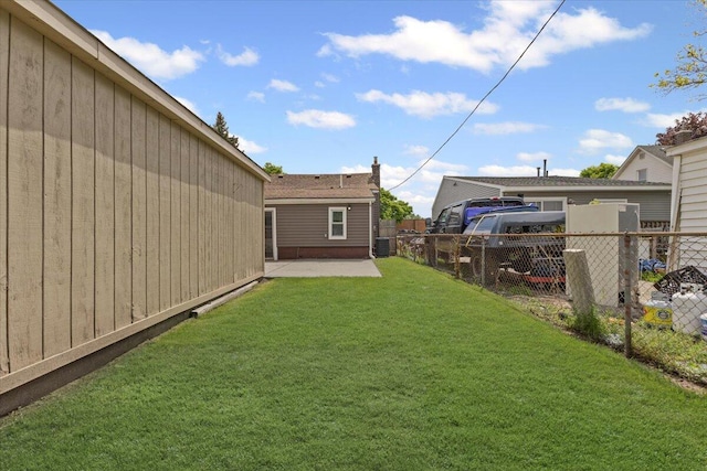 view of yard with a patio and central air condition unit