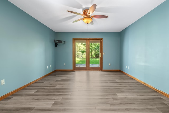 586 Schaeffer Dr, Coldwater, MI 49036 - spare room with a ceiling fan, baseboards, and light wood-style flooring