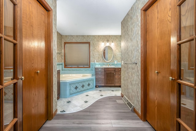 586 Schaeffer Dr, Coldwater, MI 49036 - full bathroom with a bath and vanity