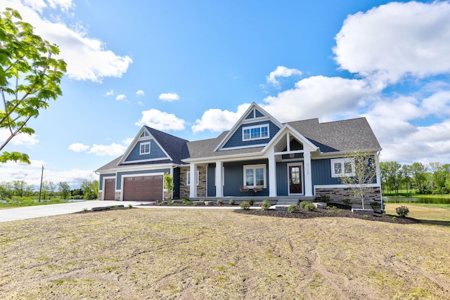 9156 Perry Ct Lot C, Lot C, Zeeland, MI 49464 - craftsman-style house with stone siding, a porch, and driveway