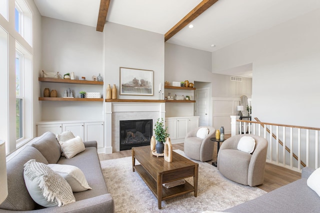9156 Perry Ct Lot C, Lot C, Zeeland, MI 49464 - living area featuring wood finished floors, beamed ceiling, a glass covered fireplace, and recessed lighting
