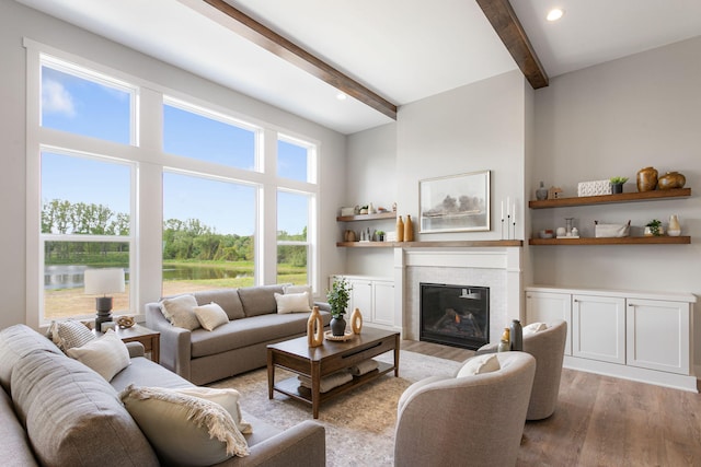 9156 Perry Ct Lot C, Lot C, Zeeland, MI 49464 - living area featuring beam ceiling, light wood-style floors, a brick fireplace, a water view, and recessed lighting