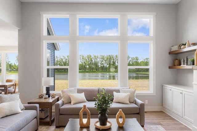 9156 Perry Ct Lot C, Lot C, Zeeland, MI 49464 - living area with a water view, light wood finished floors, and baseboards