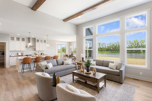 9156 Perry Ct Lot C, Lot C, Zeeland, MI 49464 - living area with beamed ceiling, light wood-style floors, recessed lighting, a water view, and baseboards