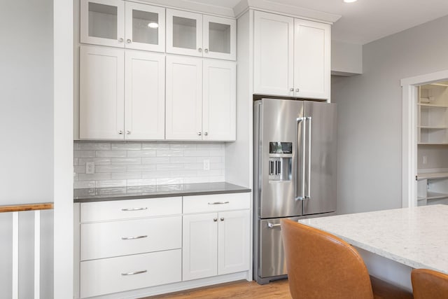 9156 Perry Ct Lot C, Lot C, Zeeland, MI 49464 - kitchen featuring high end fridge, backsplash, glass insert cabinets, and white cabinetry